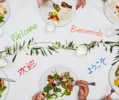 a multicultural lunch or dinner with friends around a welcome table